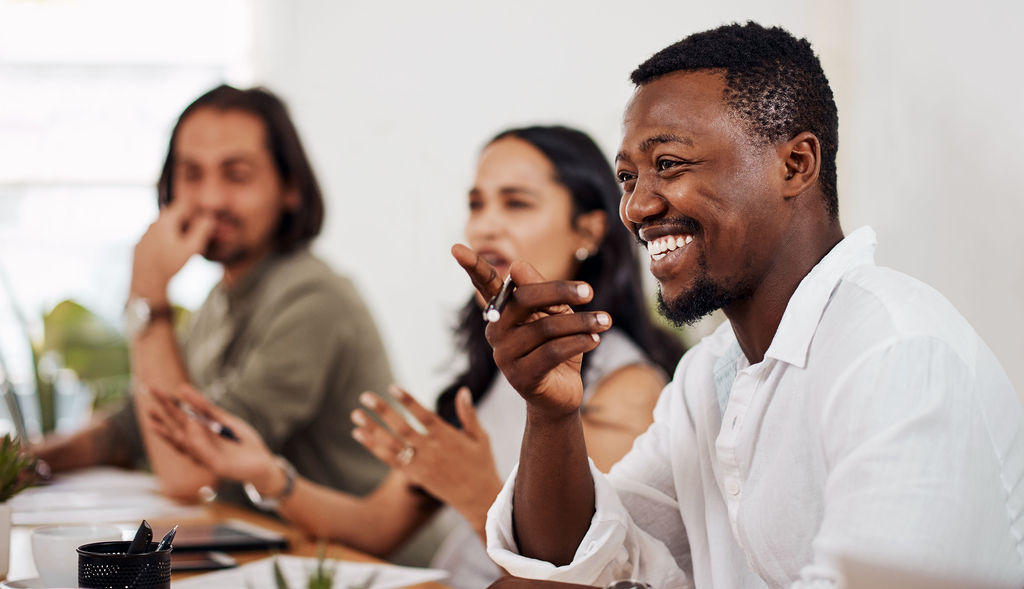 Colleagues talking together in a bright modern workplace